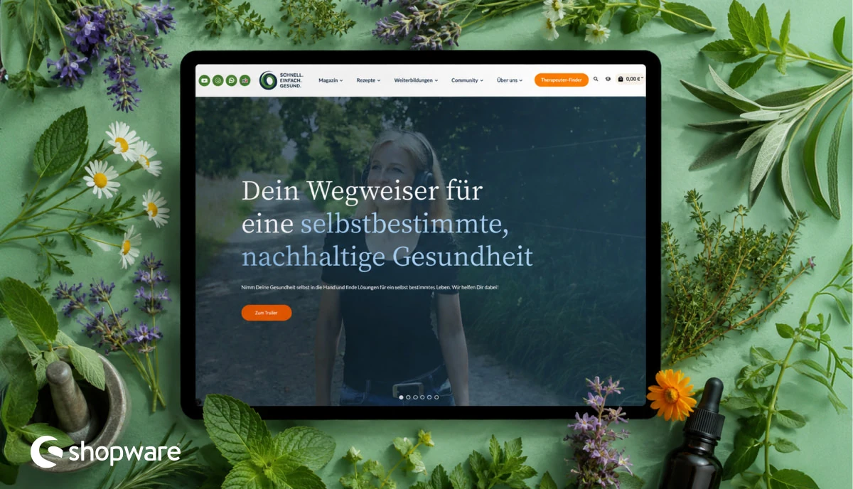 Shopware-6-Onlineshop für ganzheitliche Gesundheit auf einem Laptop, umgeben von frischen Heilkräutern.